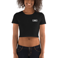 a woman wearing a black cropped t - shirt