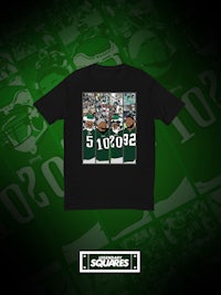 a black t - shirt with a green background and a picture of the new york jets